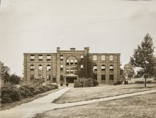 View of the structure and main approach in 1933. From the General Photographic Collection: Massachusetts: Standard-size photographs, 1860s-2000s: Massachusetts: Waltham: "Mass School for Feeble-Minded (Fernald)": Thompson and Thompson Images; Courtesy of Historic New England.