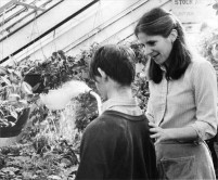 Watering plants at the Greenhouse, 1982.